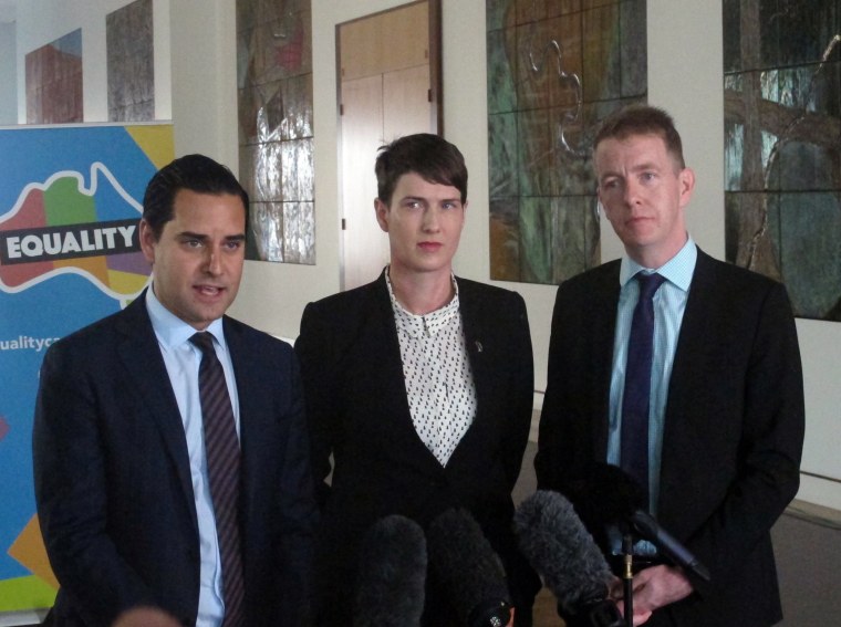 Image: marriage equality advocates Alex Greenwich, Anna Brown and Teirnan Brady address the media at Parliament House in Canberra, Australia