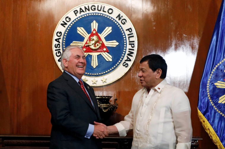 Image: Duterte shakes hands with Tillerson during a meeting at the presidential palace in Manila