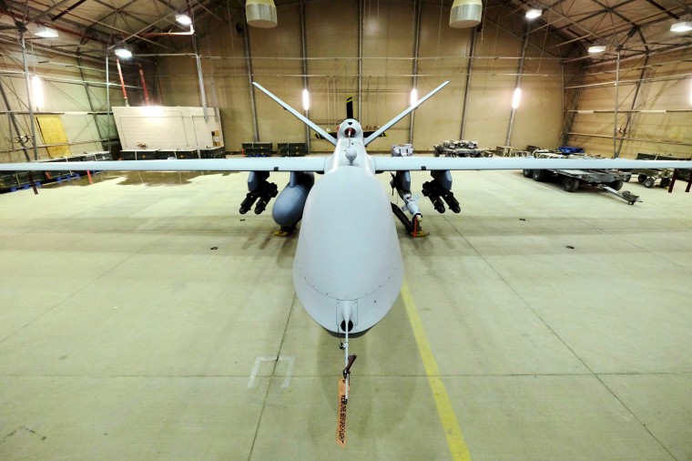 A U.S. Air Force MQ-9 Reaper drone sits armed with Hellfire missiles and a 500-pound bomb in a hanger at Kandahar Airfield, Afghanistan