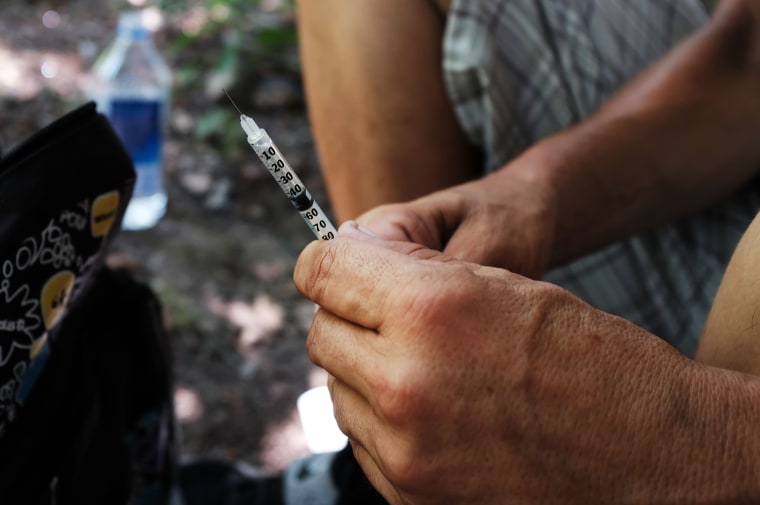 Image: Mike, a heroin addict who wants to get help, prepares to inject himself in the Kensington section of Philadelphia which has become a hub for heroin addicts on July 21, 2017 in Philadelphia, Pennsylvania.