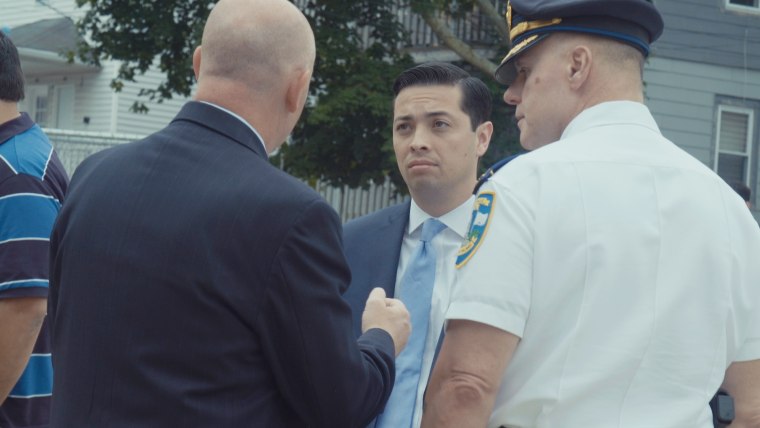 Central Falls Mayor James Diossa, 32, speaks with law enforcement officers.