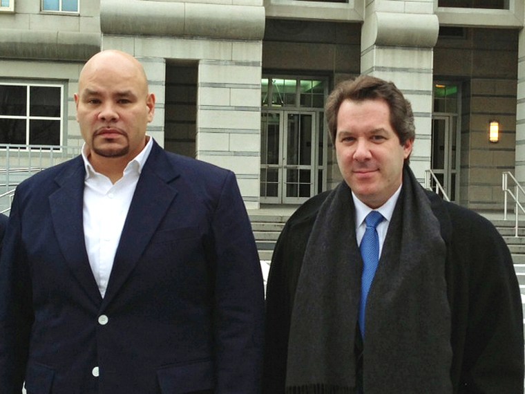 Image: "Fat Joe," left, whose real name is Joseph Cartagena, leaves court with his attorney Jeffrey Lichtman