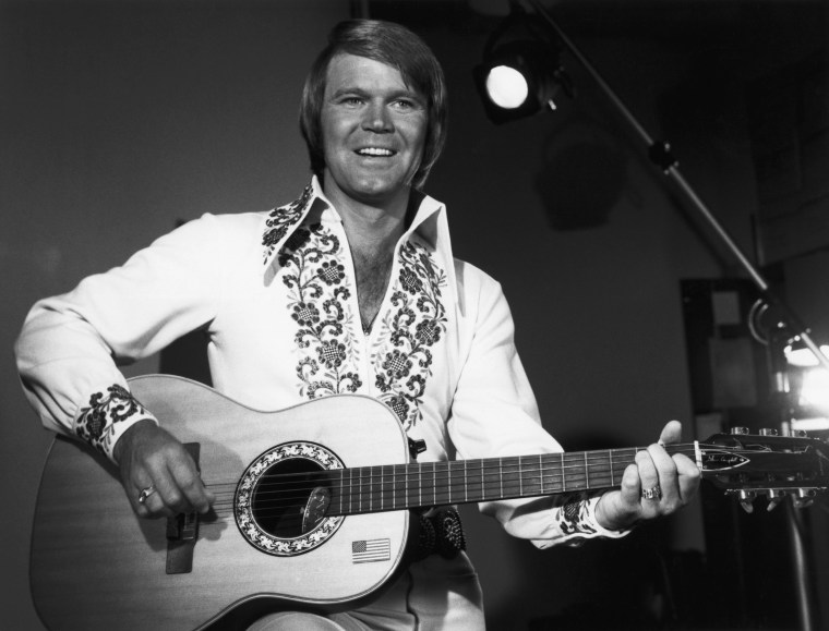 Image: Singer Glen Campbell plays guitar