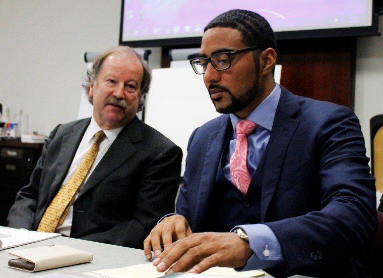 Image: Attorneys Charles Monette, left and Justin Bamberg, chat prior to a citizens review board hearing