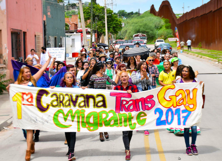 The LGBTQ refugee caravan marches together as they arrive in Nogales.
