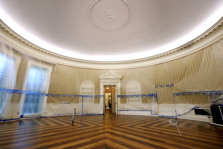 Image: The Oval Office sits empty and the walls covered with plastic sheeting