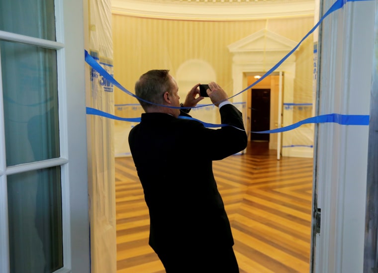Image: Former White House Press Secretary Spicer wraps himself in tape