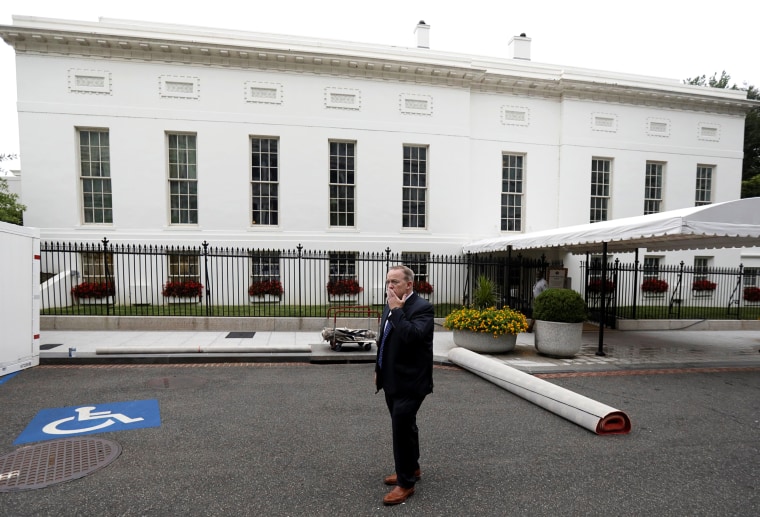 Image: Former White House Press Secretary and Communications Director Spicer stands outside the West Wing of the White House in Washington