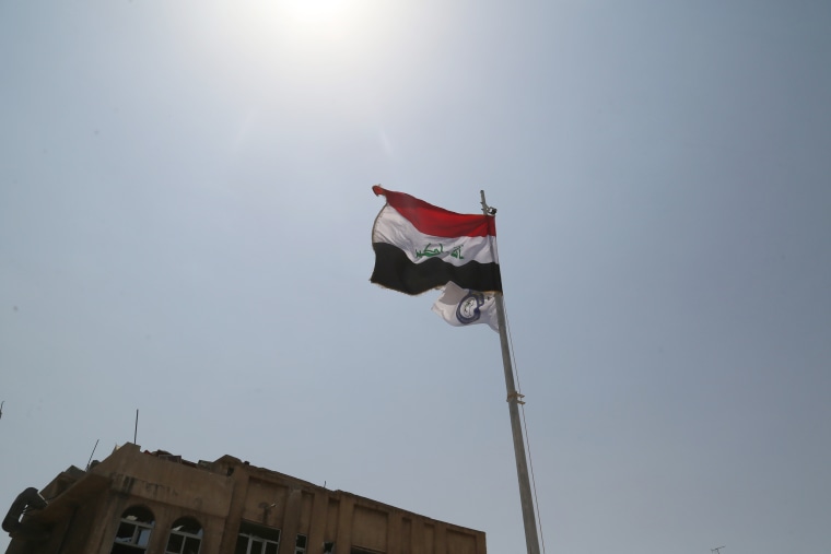 Image: An Iraq flag flies in Mosul, Iraq