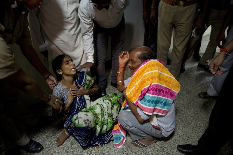 Image: 46-year-old Manthala weeps as she hears the news of the death of her one-month-old son Roshan at Baba Raghav Das Medical College Hospital in Gorakhpur, in the northern Indian state of Uttar Pradesh, Aug. 12, 2017.