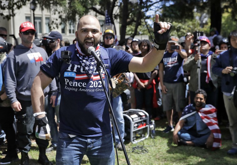 Image: Joey Gibson speaks during a rally in Berkeley