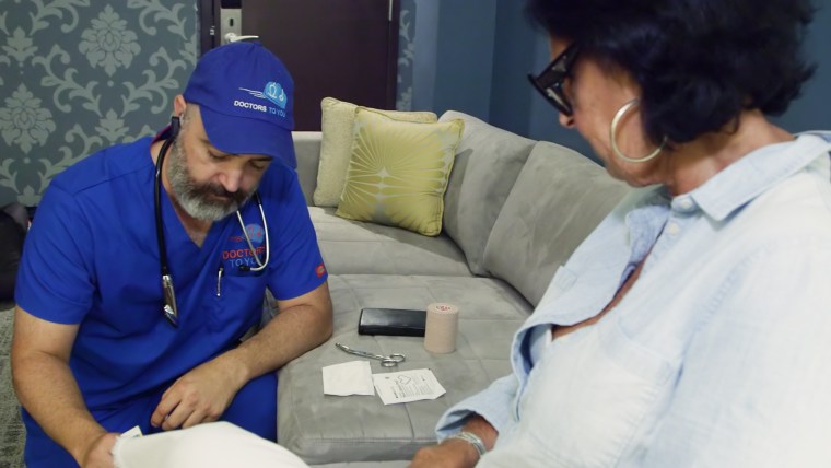 Brown with a patient at a D.C. hotel. “I can do more in one house call than I could ever do sitting in a box at a clinic, being told I have to see patients every 10 minutes," he told TODAY. 