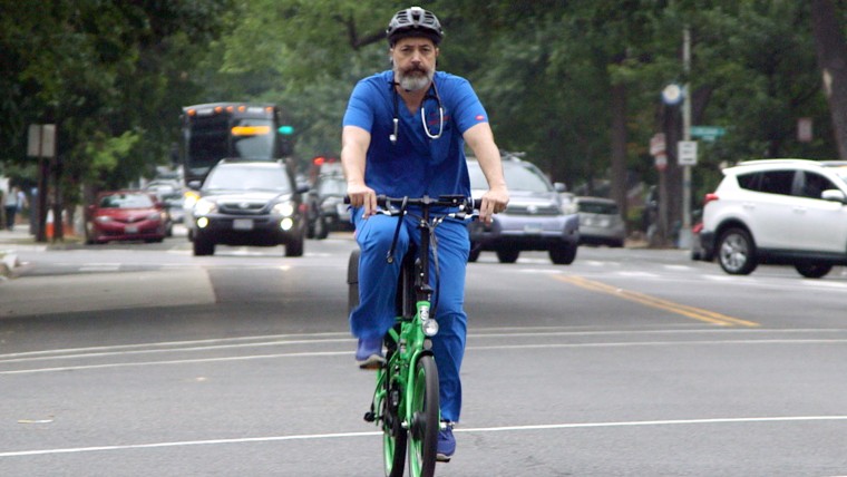 Brown often uses a bicycle to see patients. 