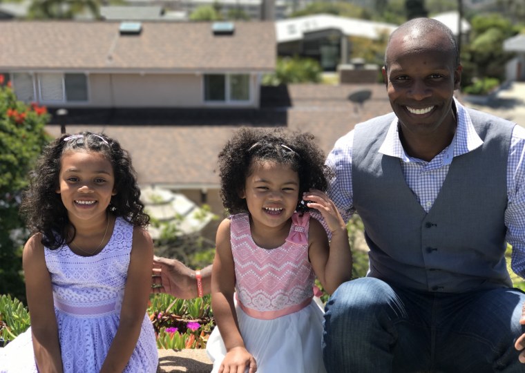 Doyin Richards with his two daughters, ages 6 and 4.