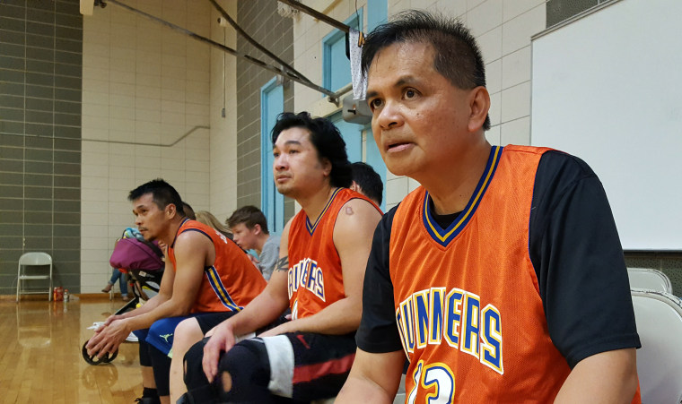 From left, Julius Paragas, Victor Malimban, and Will Daprola at a basketball tournament for amateur club teams with players of Asian descent.