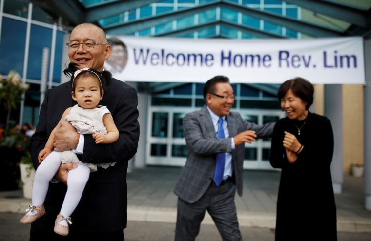 Pastor Hyeon Soo Lim holds his granddaughter in front of his wife Geum Young Lim as he leaves the Light Presbyterian Church in Mississauga, Ontario, Canada, August 13, 2017.