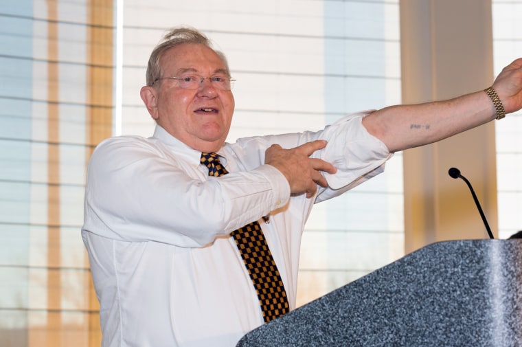 Image: Michael Bornstein, who escaped from Auschwitz at age 4, shows his concentration camp serial number tattooed on him during the Holocaust