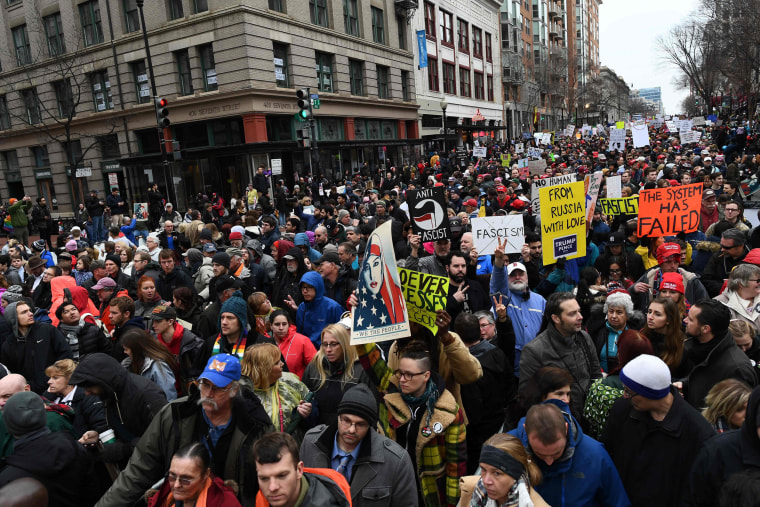 Image: Protesters display anti-Trump signs