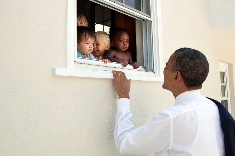 President Barack Obama greets children at a preschool in Bethesda, Maryland, on June 9, 2011.