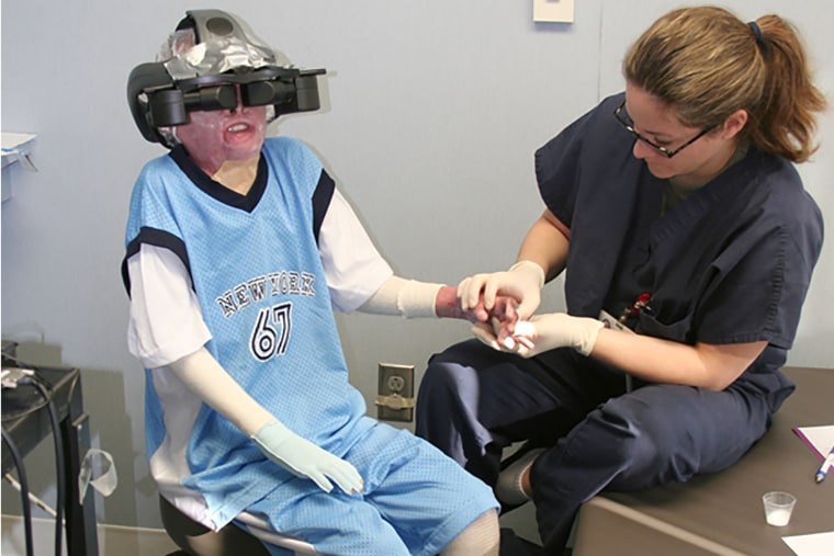 Image: A pediatric burn patient uses virtual reality to distract from pain during physical therapy exercises at Shriners Children Hospital in Galveston, Texas.