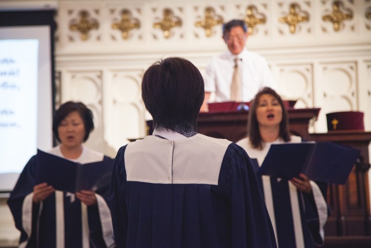 A woman sings during a Russian-language sermon led by the Rev. Leonid Kim in Brooklyn, New York.