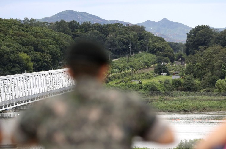 Image: A South Korean soldier watches the north side