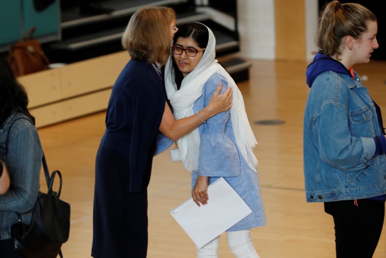 Image: Malala Yousefzai is congratulated after collecting her exam results at Edgbaston High School for Girls in Birmingham, England.