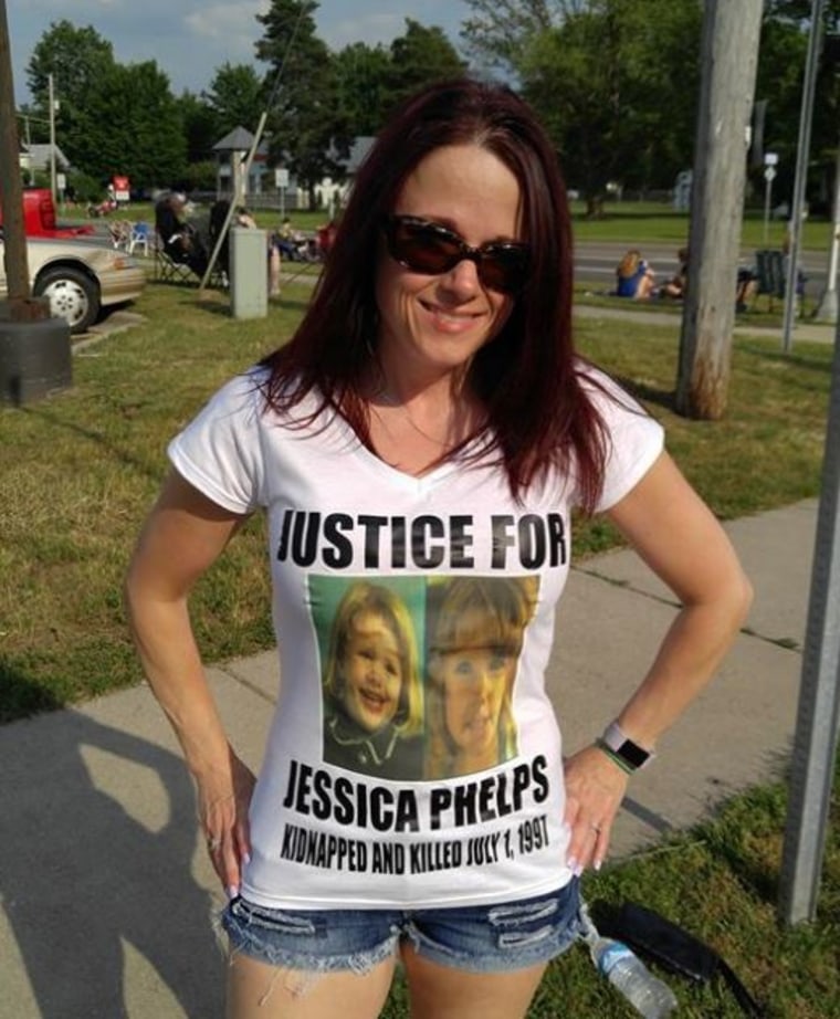 Angie Spade, Jessica Phelps' cousin, wears a t-shirt with Jessica's photo and information on it.