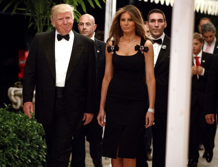 Image: This Dec. 31, 2016 file photo shows President-elect Donald Trump and his wife Melania Trump arriving for a New Year's Eve party at Mar-a-Lago in Palm Beach, Florida.