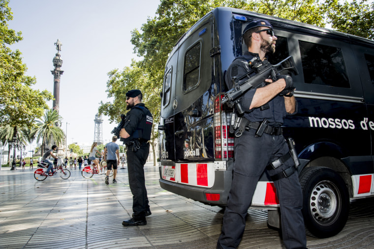 Image: Police are deployed to guard an area located at the end of Las Ramblas following a terrorist attack on Aug. 17.