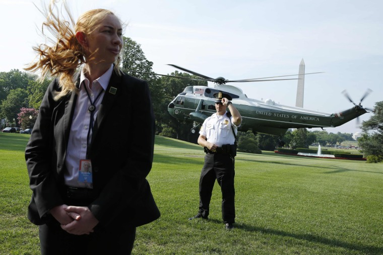 Image: U.S. Secret Service agents standing guard as Marine One helicopter with President Donald Trump on board