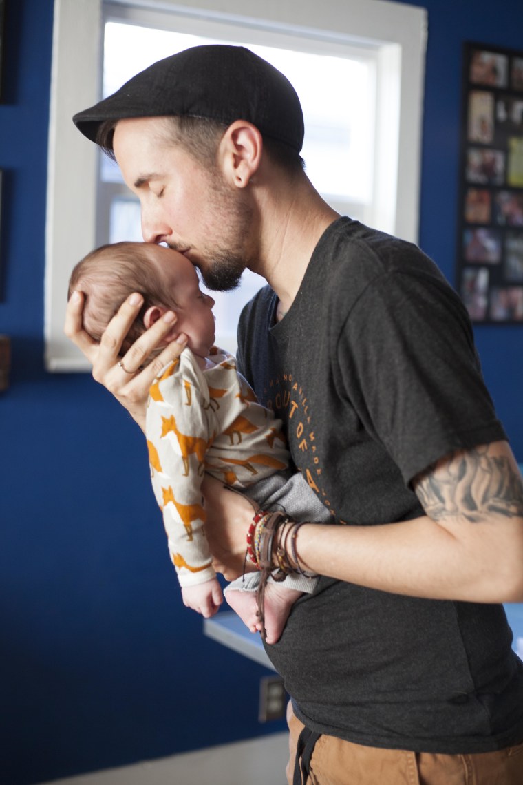 Trystan Reese, a transgender man, and his biological newborn, Leo.