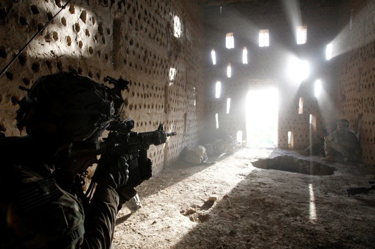 Image: FILE PHOTO: U.S. soldier points his rifle after coming under fire in Zharay district in Kandahar province, southern Afghanistan