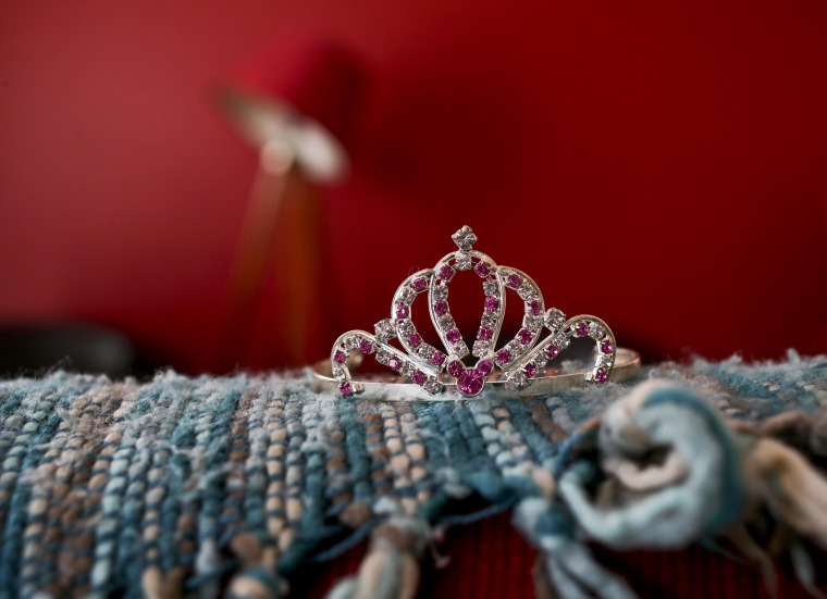 Image: A rhinestoned crown sits on a sofa in Luna's home in Santiago, Chile.