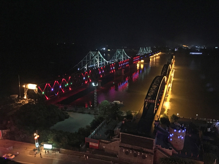 The Friendship Bridge crosses the Yalu River and connects Dandong, China with Sinuiju, North Korea.