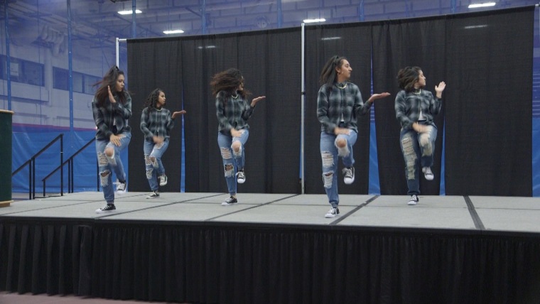 Pi Lambda Chi step team members perform at the La Raza Youth Conference in Denver.