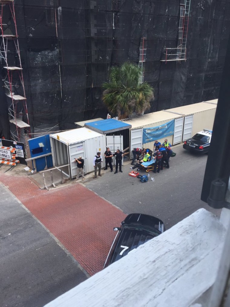 Image: First responders and police surround an injured person in Charleston, South Carolina