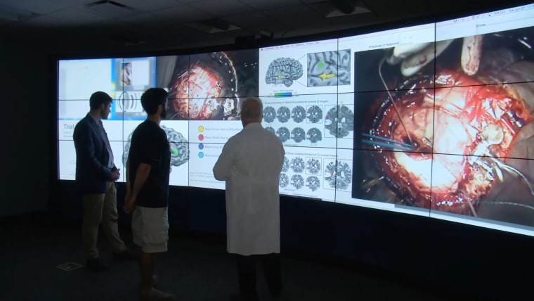 Image: Pictured in this photograph, from left to right, are neuroscientist Brad Mahon, Dan Fabbio, the patient, and neurosurgeon Web Pilcher.
