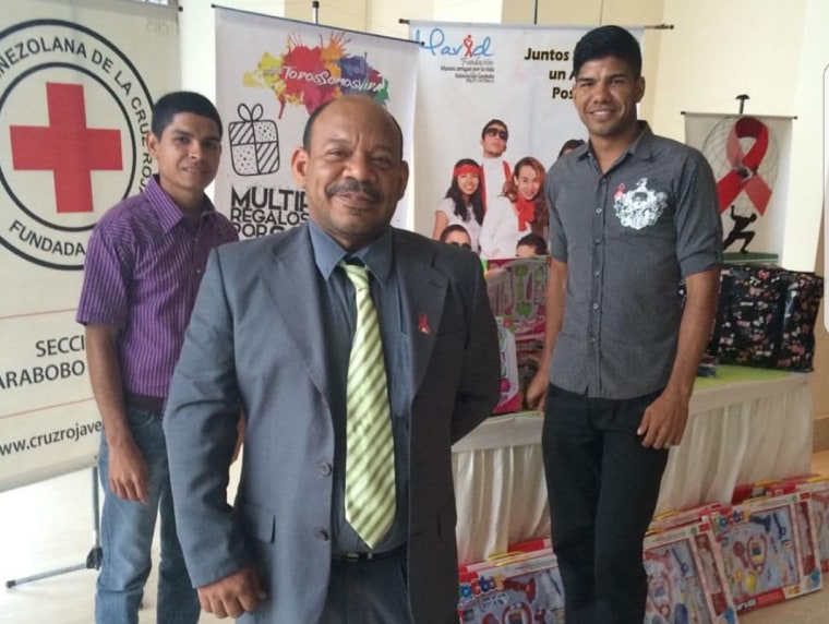 Eduardo Franco (center) at an event providing information about his HIV/AIDS organization, MAVID, which is based in Carabobo, Venezuela.