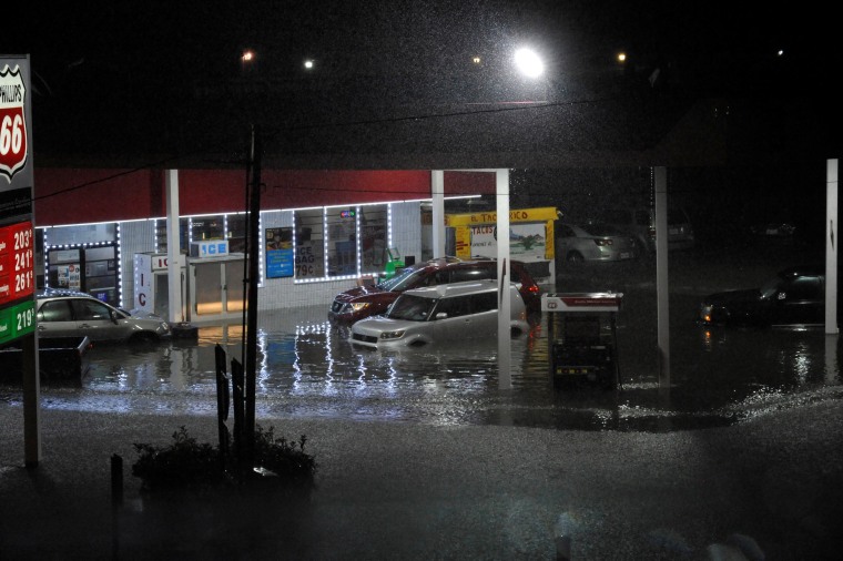Image: Cars sit abandoned at a flooded gas station after Hurricane Harvey made landfall on the Texas Gulf coast and brought heavy rain to the region