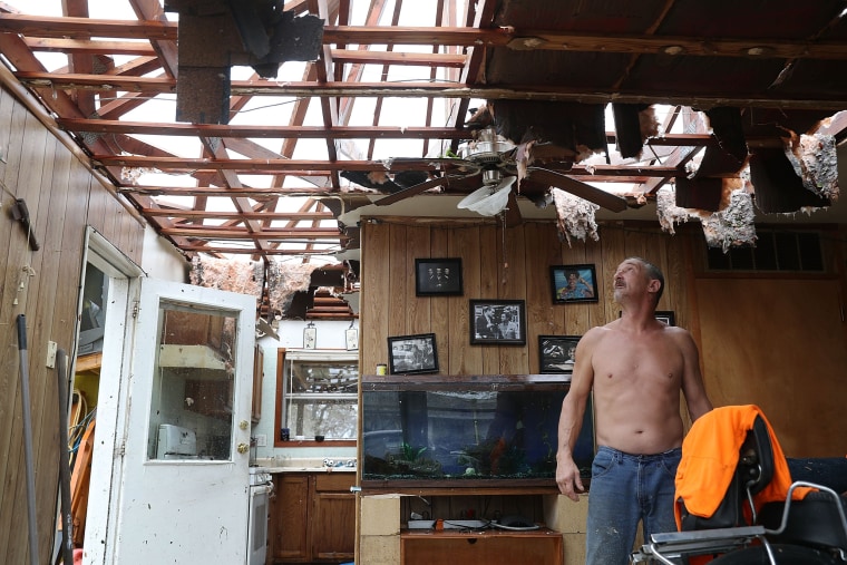 Image: Aaron Tobias who said he lost everything stands in what is left of his home  after Hurricane Harvey blew in and destroyed most of the house