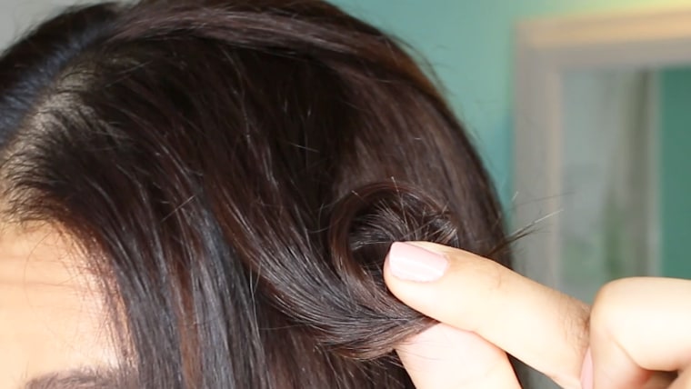 Create pin curls by winding 2-inch sections of hair around your finger.