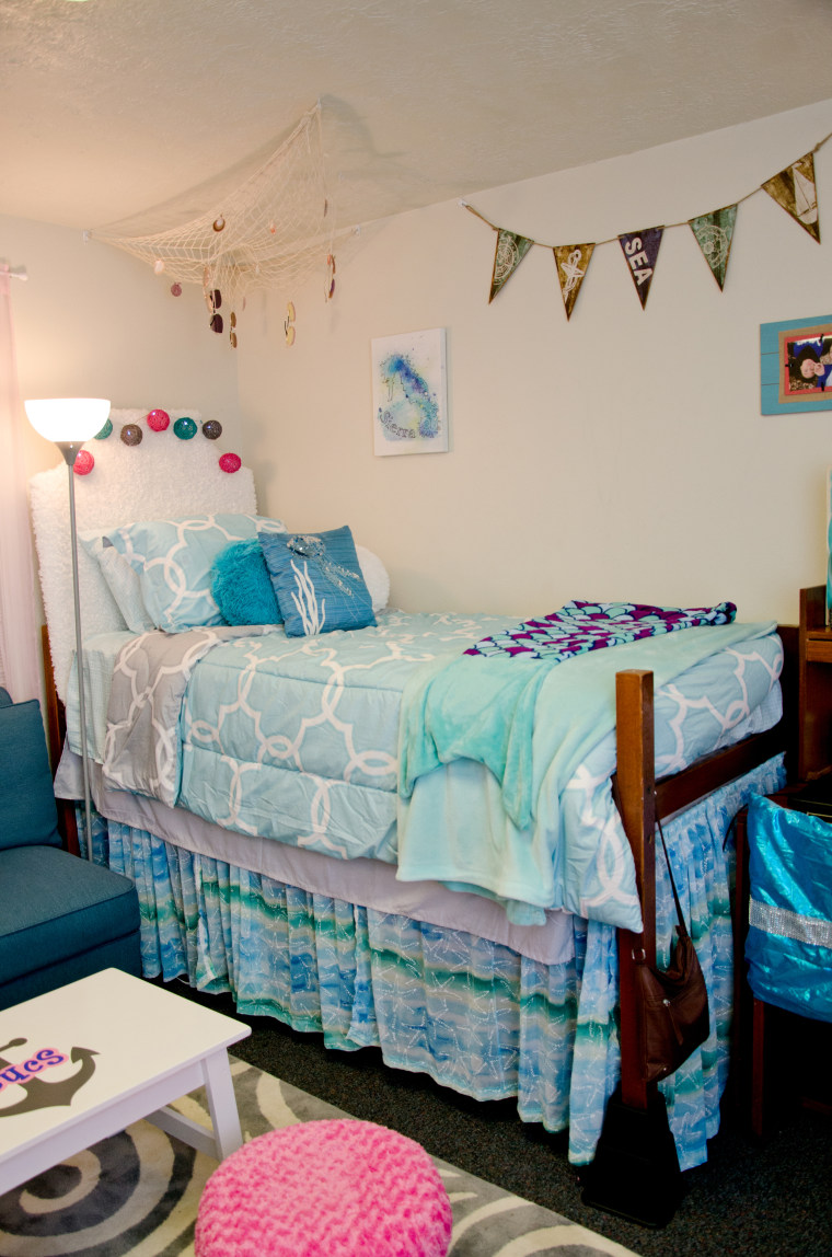 One bed in the dorm room. The furnishings were found on Craigslist, bought secondhand or from stores at steep discounts. 