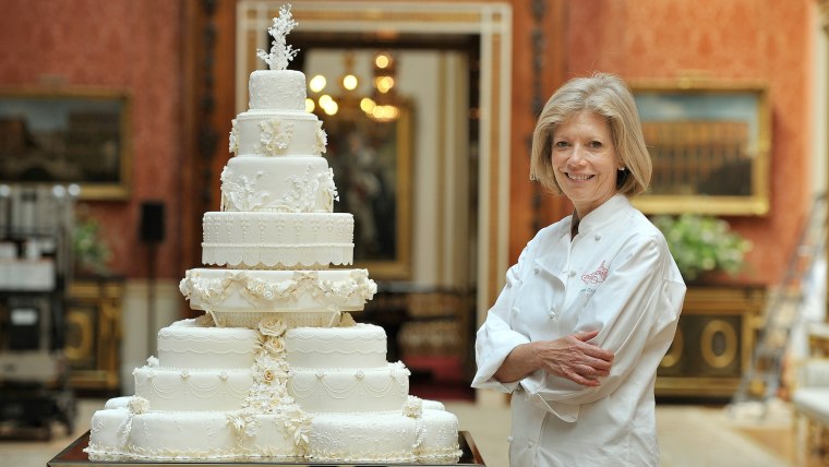 Fiona Cairns stands next to the Royal Wedding cake