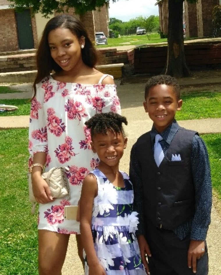 J'ia with her 8-year-old brother and 5-year-old sister.