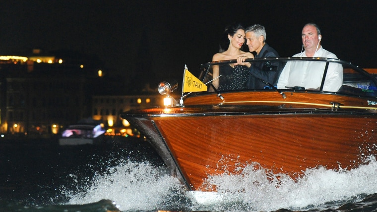 George Clooney and Amal Alamuddin seen on a taxi boat in Venice