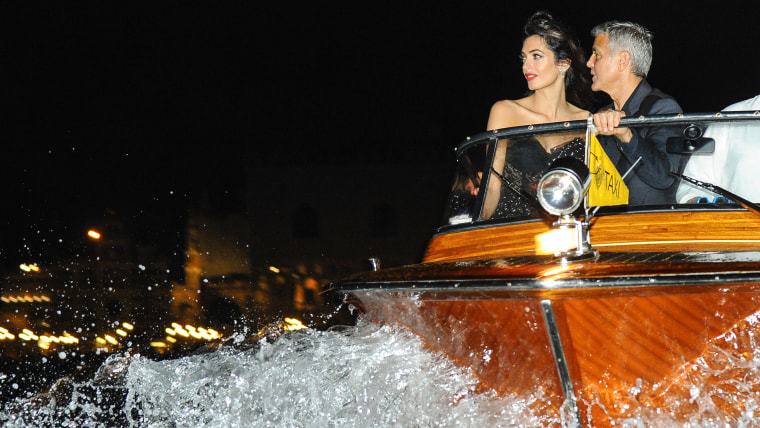 George Clooney and Amal Alamuddin seen on a taxi boat in Venice