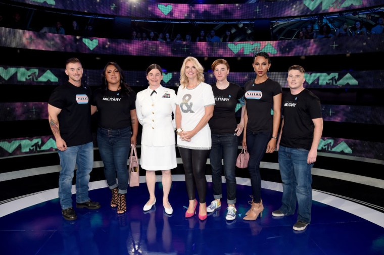 President of GLAAD Sarah Kate Ellis (center) and transgender military members attend the 2017 MTV Video Music Awards at The Forum on August 27, 2017 in Inglewood, California.