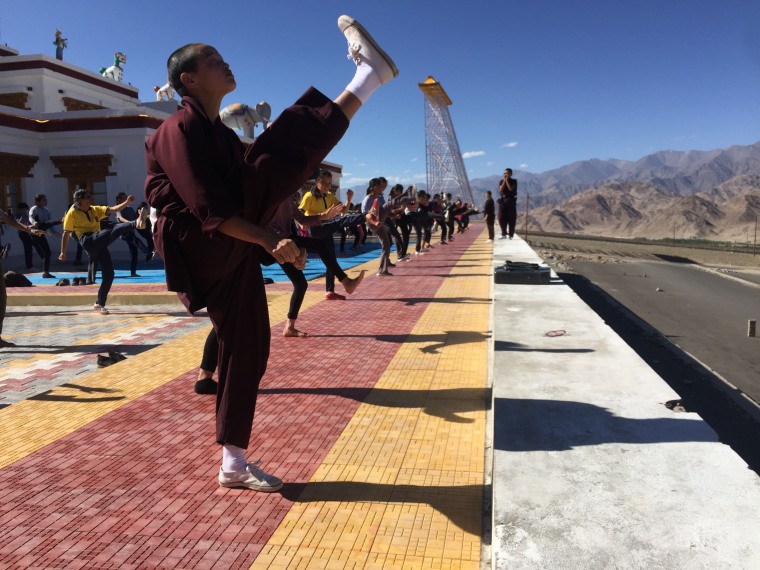 Girls from India's Ladakh region practice kicking with a group of nuns who practice kung fu.