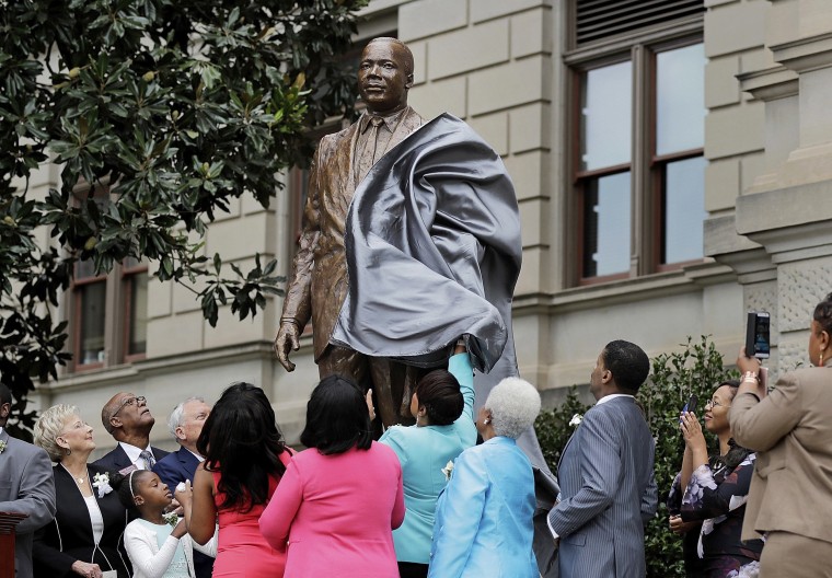 Image: A statue paying tribute to civil rights leader Martin Luther King Jr. is unveiled on the state Capitol grounds in Atlanta